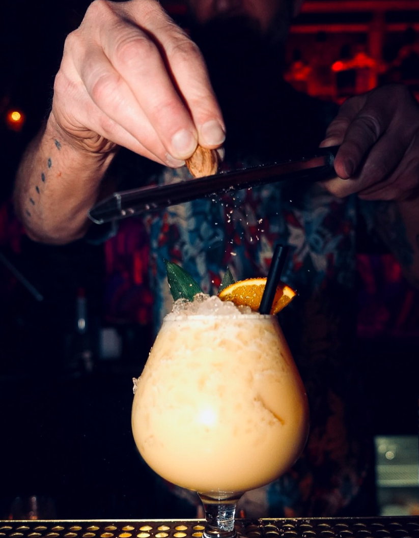 Bartender garnishing a drink
